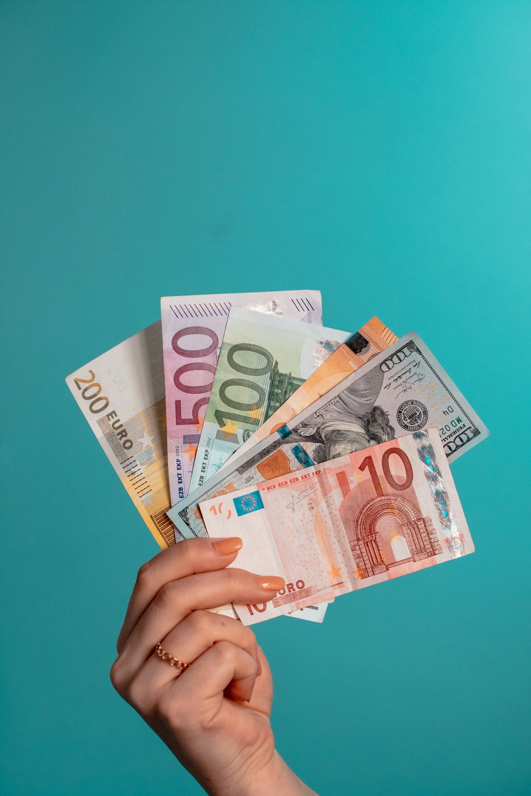 person-holding-fan-of-100-us-dollar-bill-8nppe0ylmn8